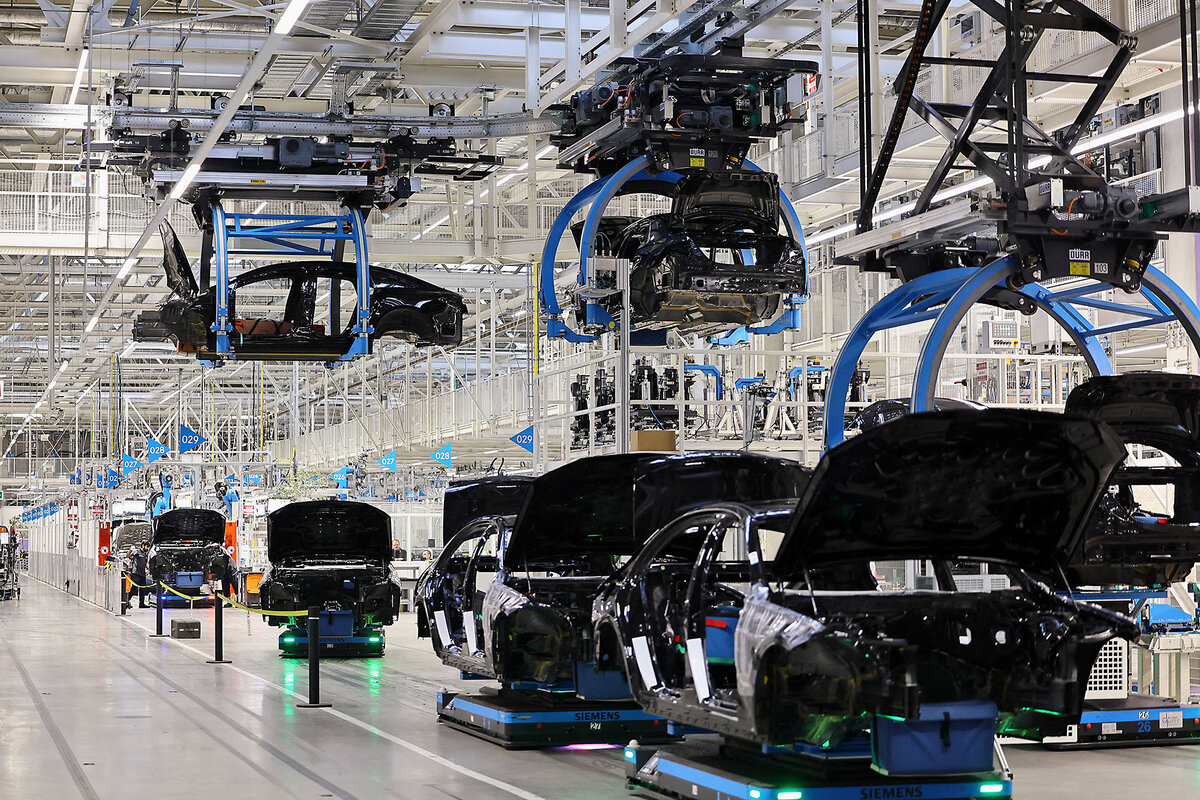Blue car bodies are lifted at "Factory 56", one of the world's most modern car assembly halls of Mercedes-Benz.